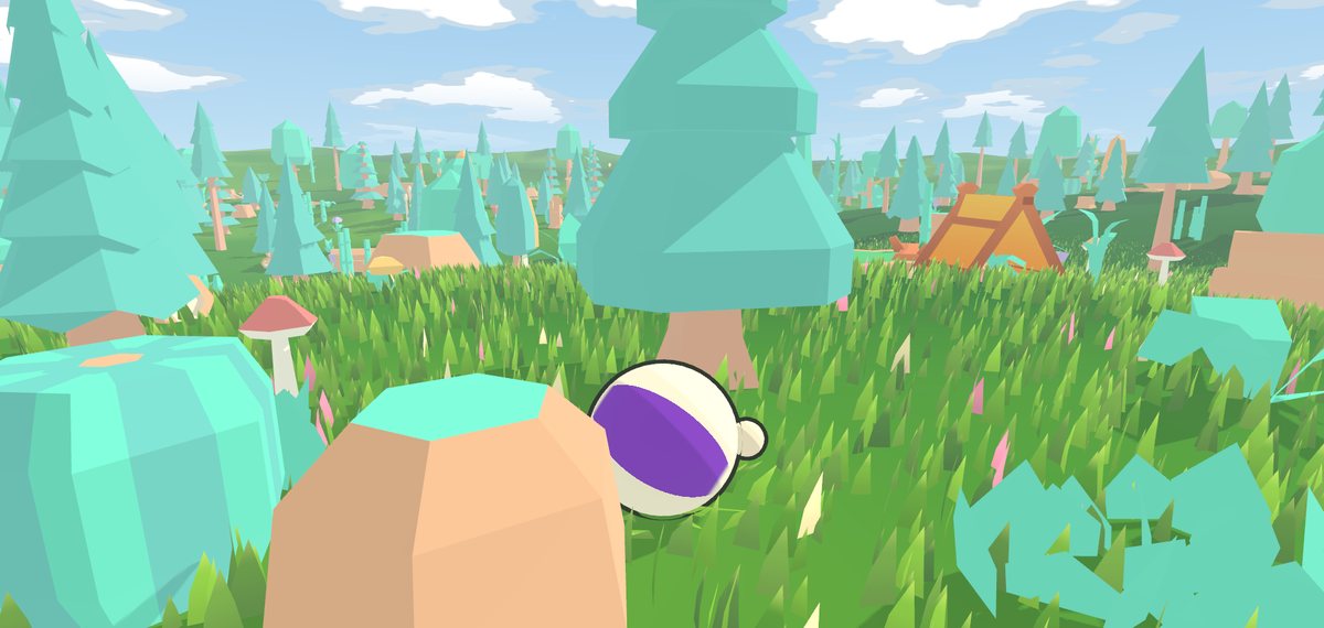 A kolobok by a boulder at the edge of the forest camp